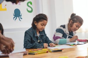 two girls doing school work