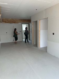 women previewing building under construction